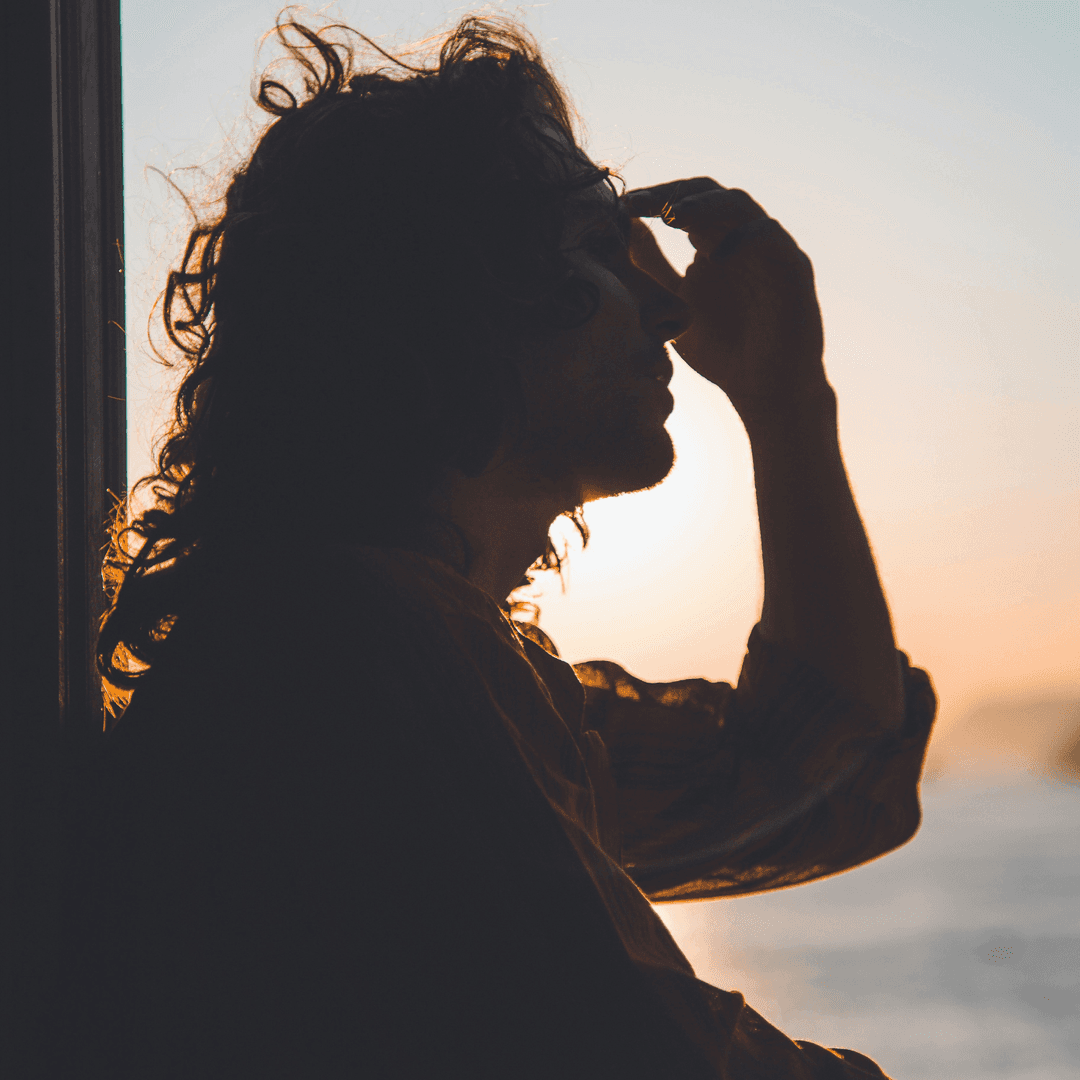 silhouette of girl with migraine